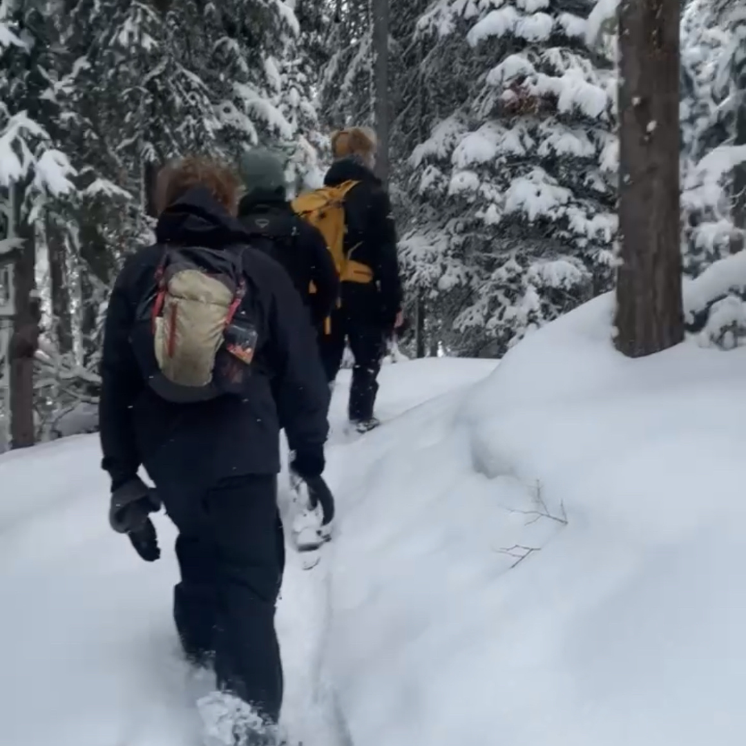 Traveler loving life after finishing a shift at a ski resort during a paid work and travel program