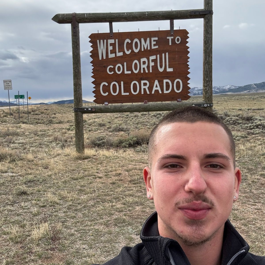 Young adult beginning a travel adventure while reflecting on life direction and personal growth.