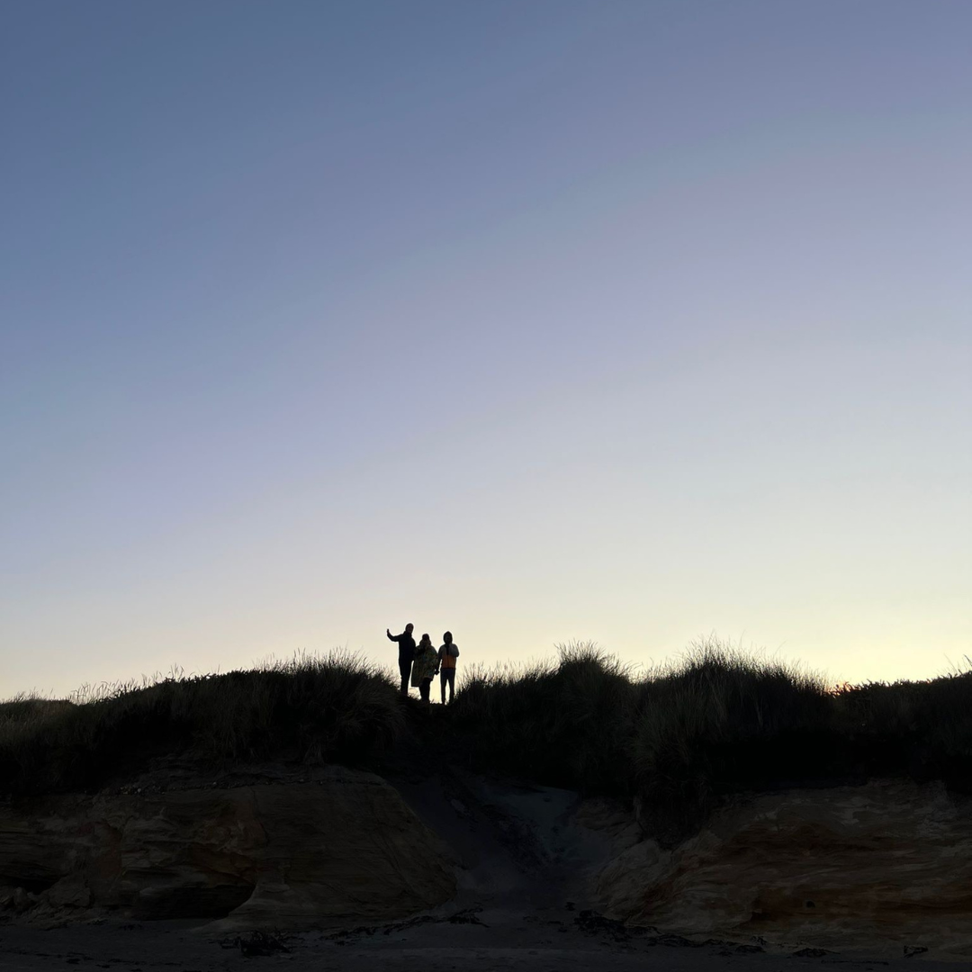 Take a Year to Travel, Meet People, and Actually Build Something Group of young adults laughing and socializing outdoors during a work travel program