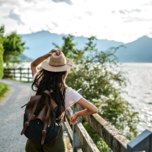 The Riskiest Thing You Can Do After High School Might Be Playing It Safe Young adults standing at a crossroads deciding between traditional college and new travel and work experiences.