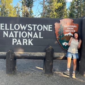 A wide-angle view of a national park landscape at golden hour — forested valleys, mountains, and a winding river — representing the outdoor access available to AdventureEXP seasonal workers.
