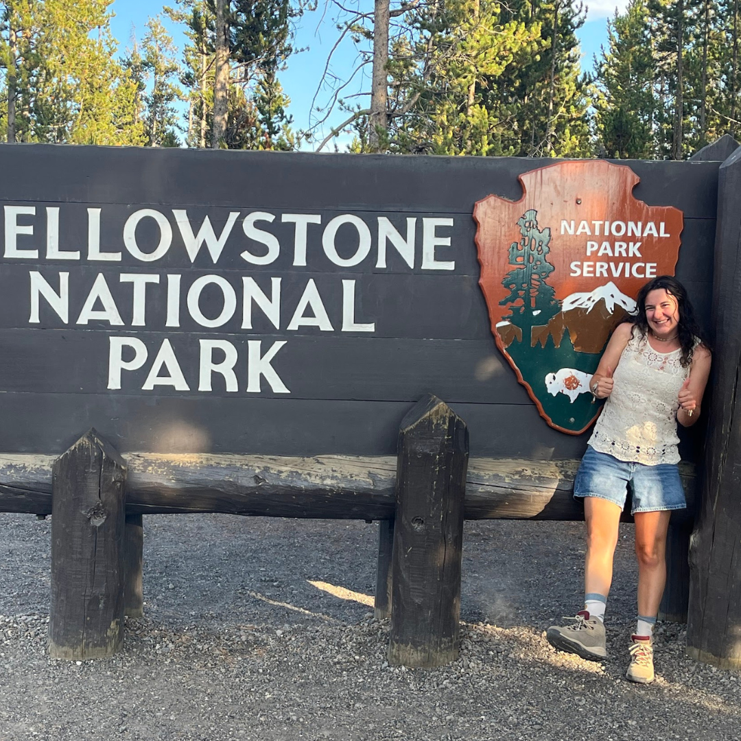 A wide-angle view of a national park landscape at golden hour — forested valleys, mountains, and a winding river — representing the outdoor access available to AdventureEXP seasonal workers.