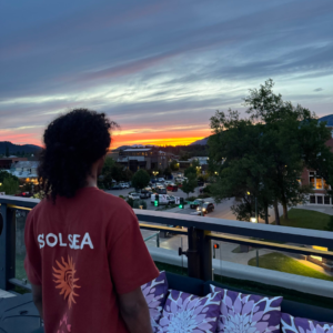 For the Parents: What AdventureEXP Actually Is (and Why It Might Be the Best Thing for Your Kid) young adult on their gap year thinking about their future while having fun and making money.